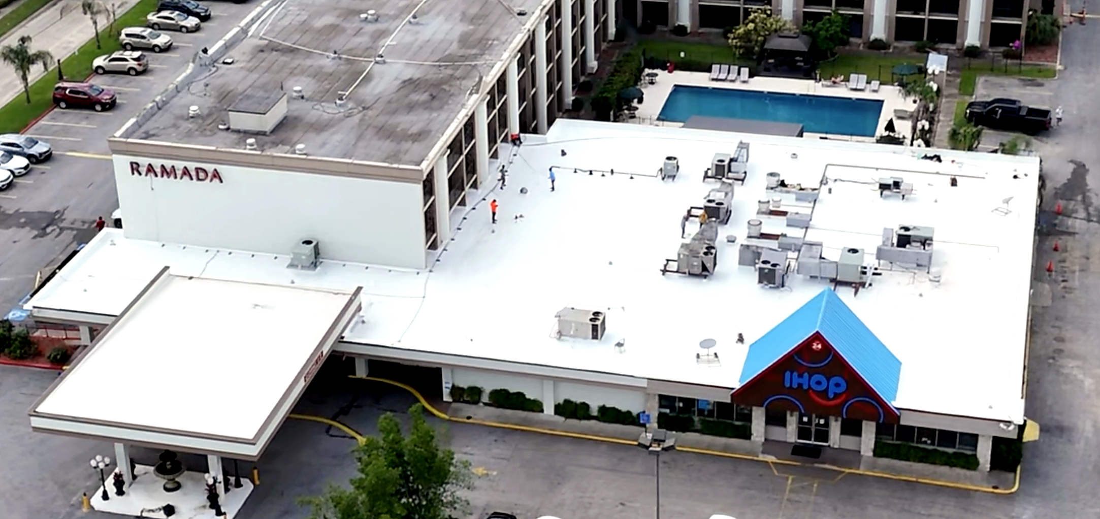 Commercial white flat roof aerial view